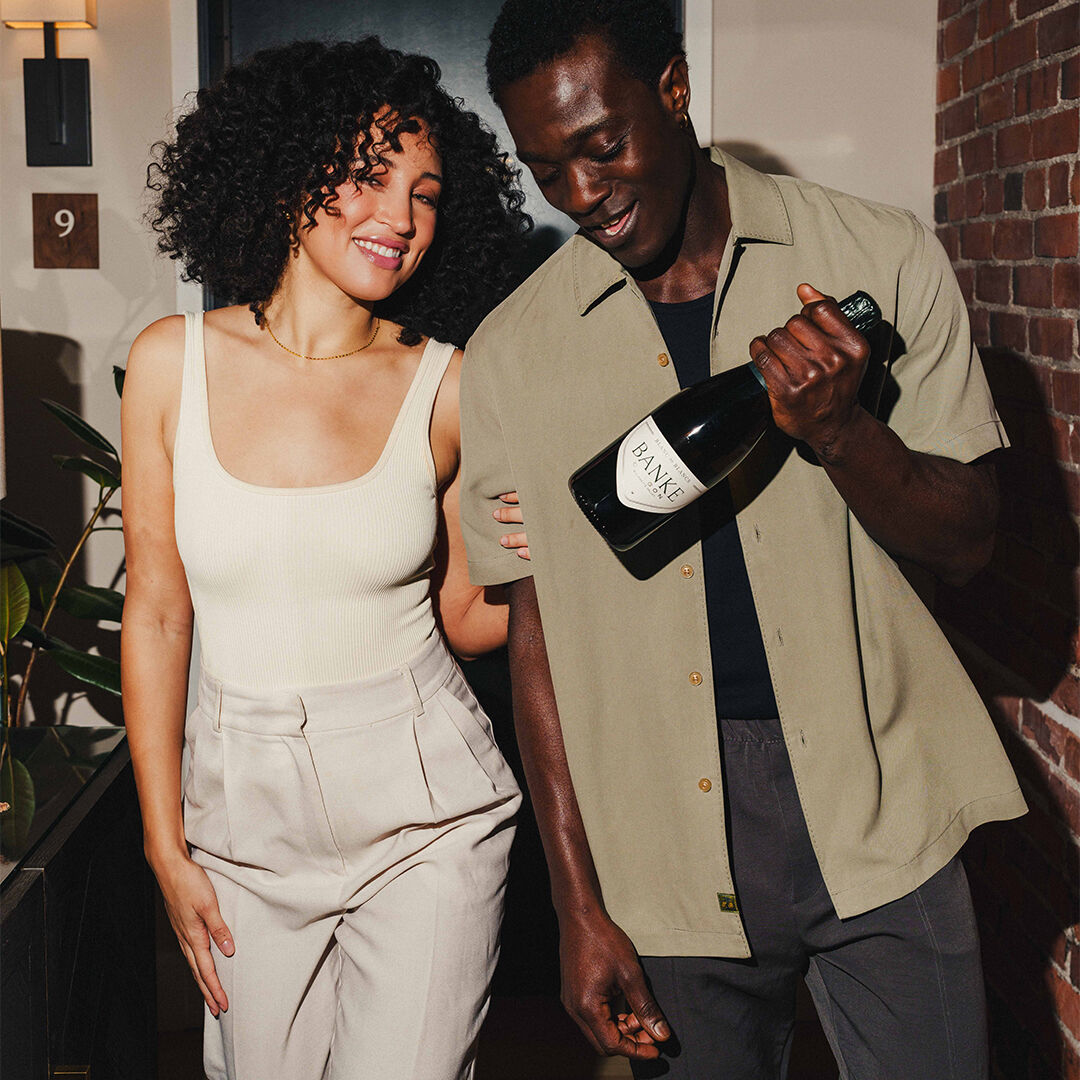 2 friends about to enjoy a bottle of Banke wine